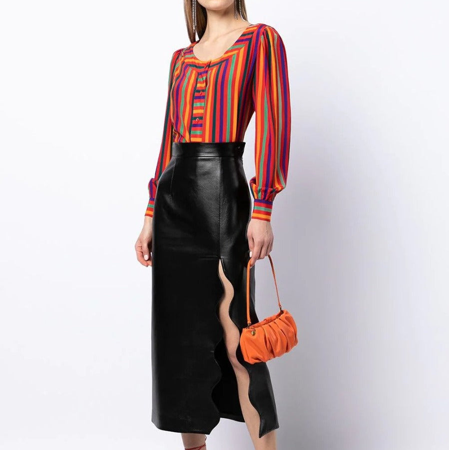Yves Saint Laurent Rive Gauche striped silk blouse worn as a stylish top, featuring classic vertical stripes and elegant fabric.